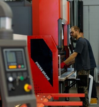 a man working on a machine in a factory