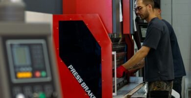 a man working on a machine in a factory